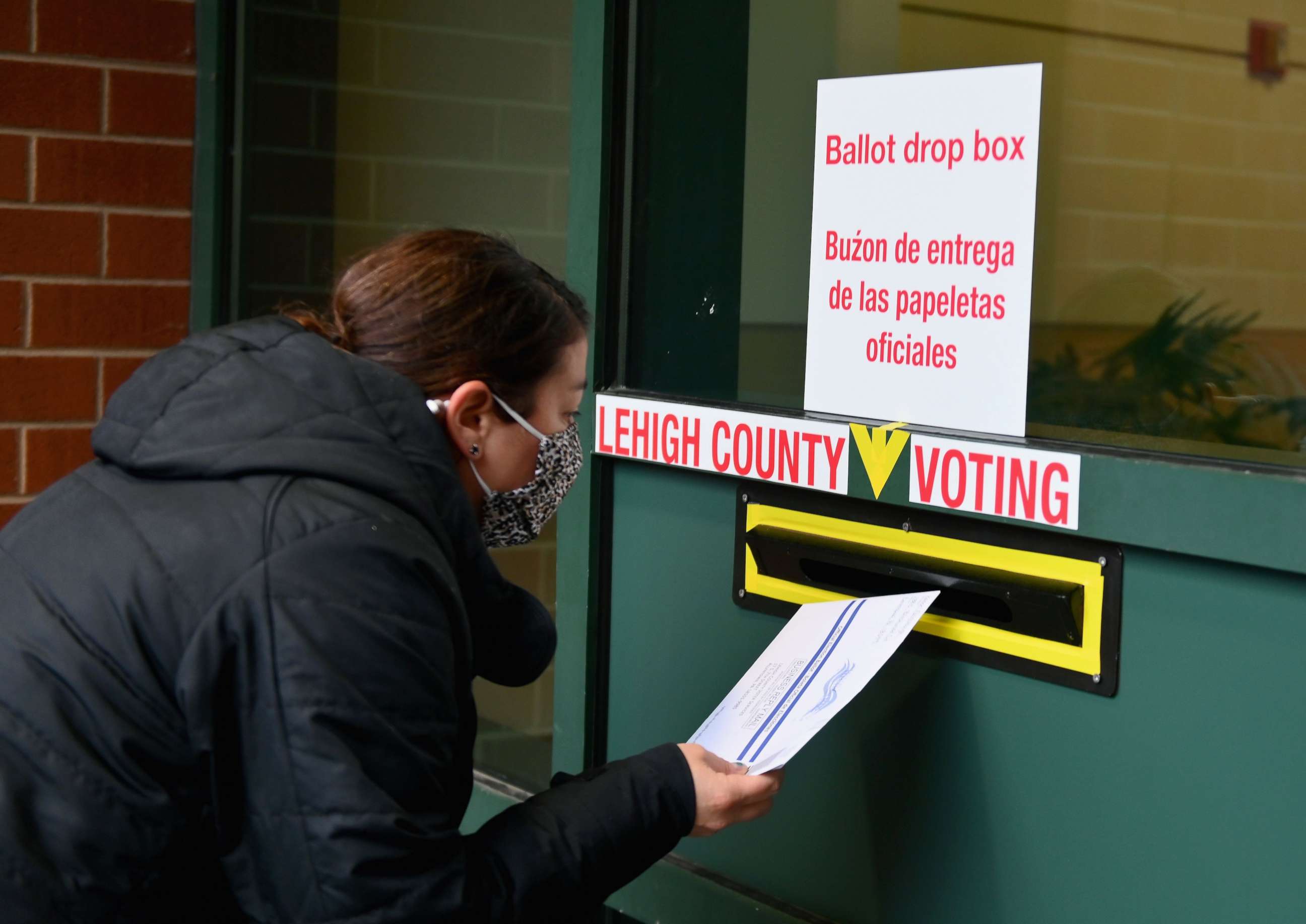 PHOTO: A voter arrives to drop off he ballot during early voting in Allentown, Pa., on Oct. 29, 2020.
