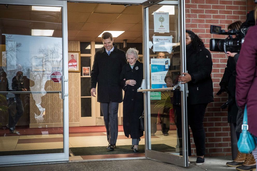 PHOTO: Conor Lamb and his grandmother Barbara Lamb exit the polling station after she voted at Our Lady of Victory Church, March 13, 2018 in Carnegie, Pa.