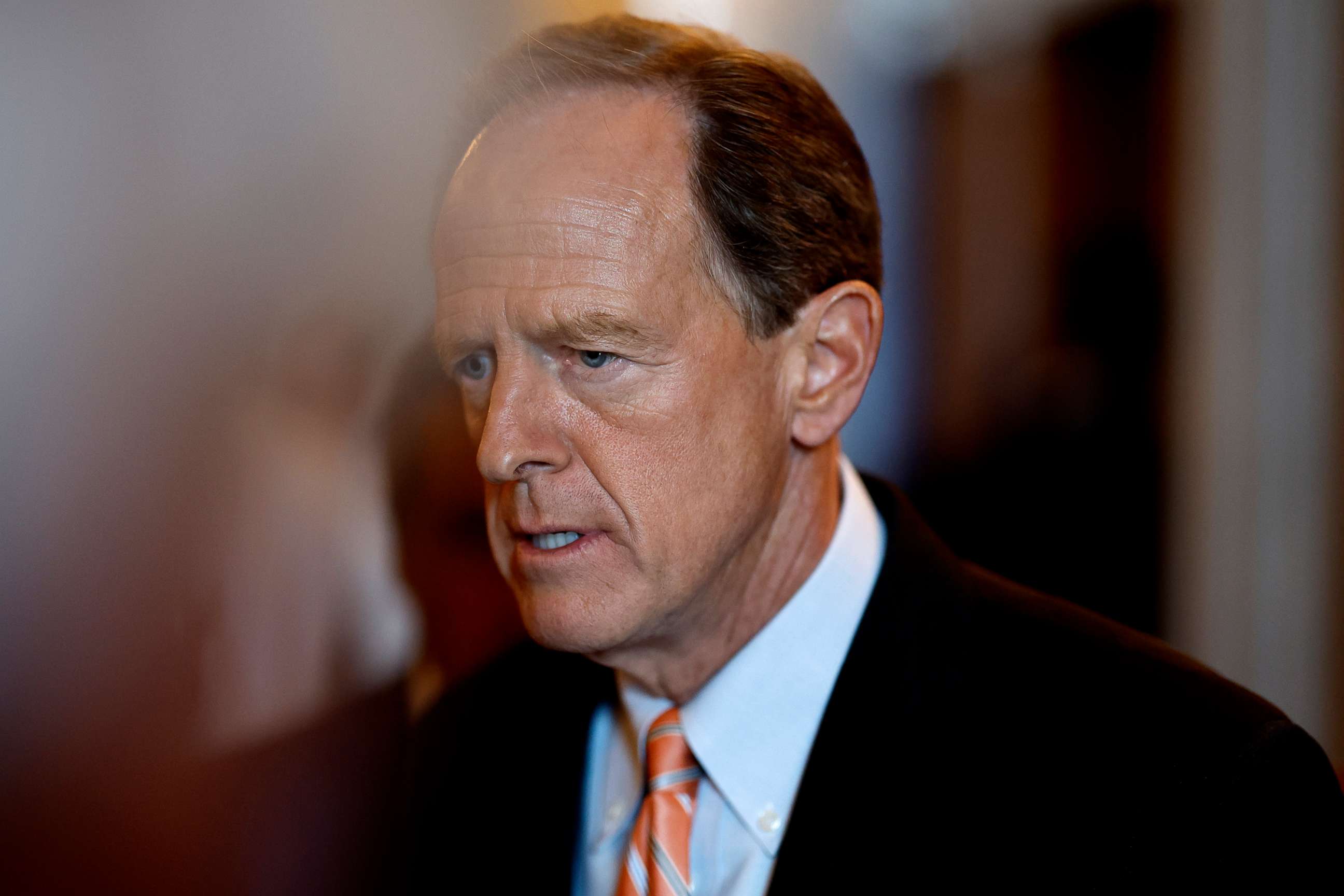 PHOTO: Sen. Pat Toomey  walks out of the Senate Chambers during a nomination vote in the U.S. Capitol Building in Washington, Aug. 1, 2022. 