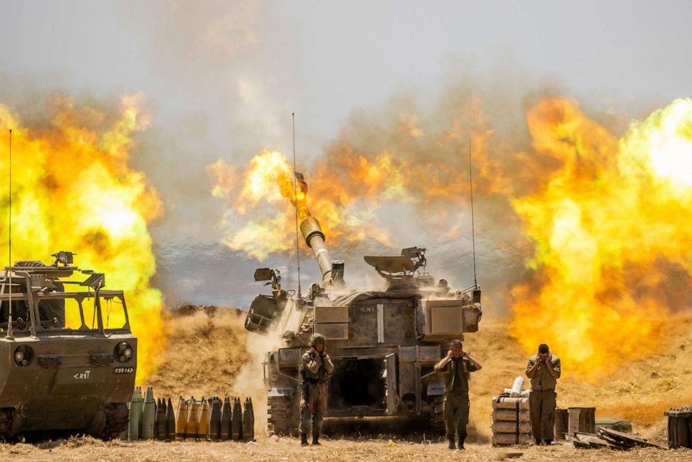 PHOTO: An Israeli artillery unit fires toward targets in Gaza Strip, at the Israeli Gaza border, May 12, 2021.