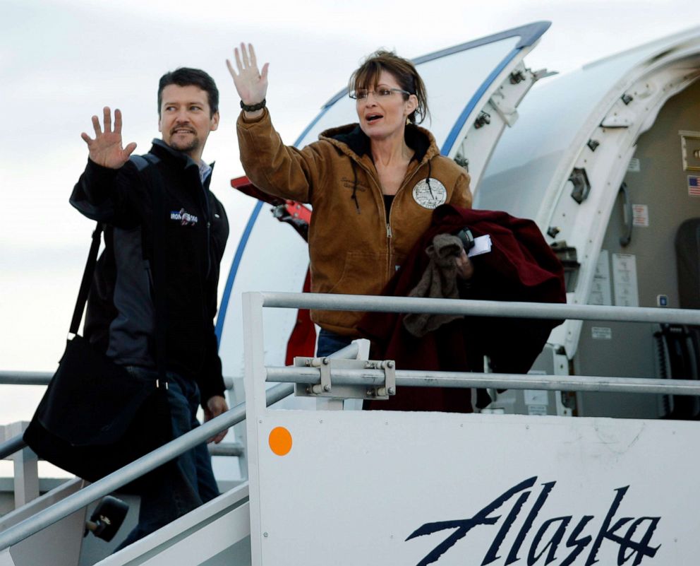 PHOTO: In this Nov. 4, 2008 file photo, Republican vice presidential candidate Alaska Gov. Sarah Palin and her husband Todd wave as they leave Anchorage International Airport in Anchorage bound for Wasilla to vote in the presidential election. 