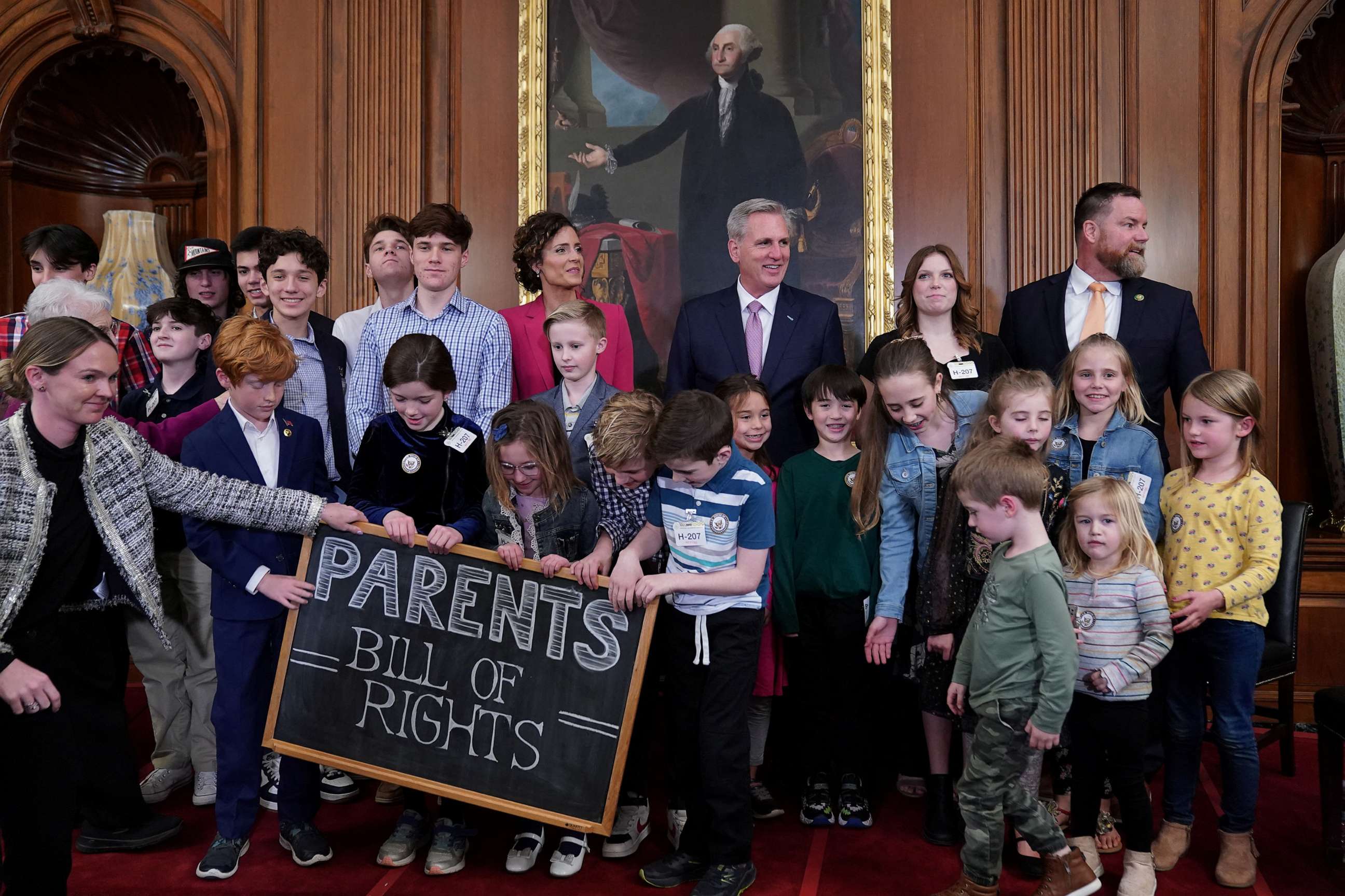 PHOTO: House Speaker Kevin McCarthy and Rep. Julia Letlow pose for a photo with children during an introduction of the "Parents' Bill of Rights," on Capitol Hill, March 1, 2023, in Washington.