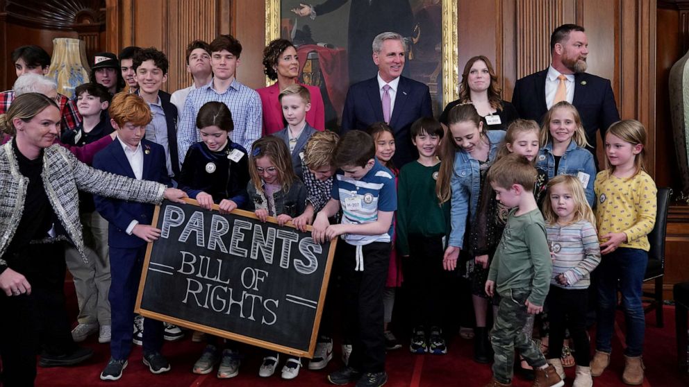 PHOTO: House Speaker Kevin McCarthy and Rep. Julia Letlow pose for a photo with children during an introduction of the "Parents' Bill of Rights," on Capitol Hill, March 1, 2023, in Washington.