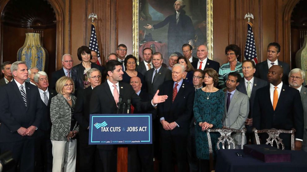 House Speaker Paul Ryan, flanked by Republican lawmakers, speaks during an enrollment ceremony for the conference report to H.R. 1, the Tax Cuts and Jobs Act. that was passed this week by the House and Senate, at the U.S. Capitol, Dec. 21, 2017.