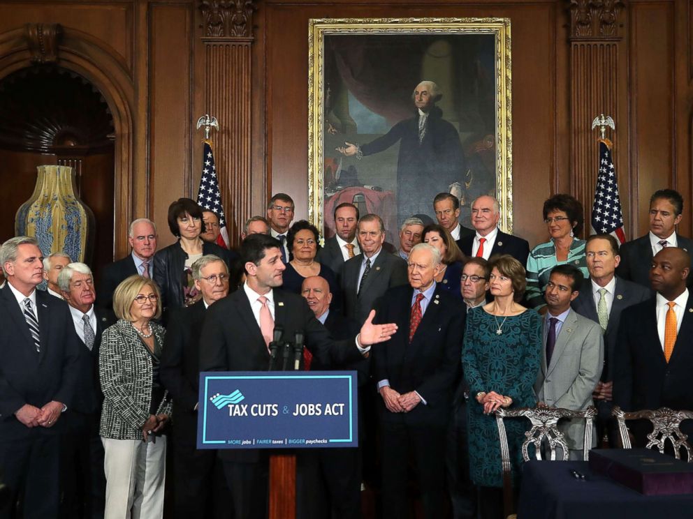 PHOTO: House Speaker Paul Ryan, flanked by Republican lawmakers, speaks during an enrollment ceremony for the conference report to H.R. 1, the Tax Cuts and Jobs Act. that was passed this week by the House and Senate, at the U.S. Capitol, Dec. 21, 2017.