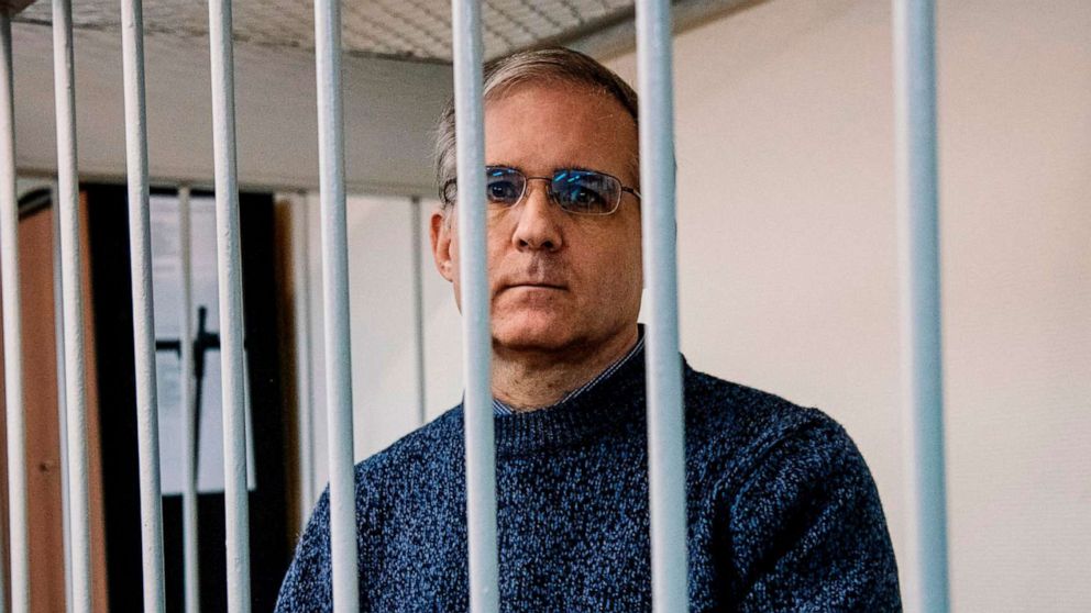 PHOTO: Paul Whelan, a former U.S. Marine accused of espionage and arrested in Russia in Dec. 2018, holds a message as he stands inside a defendants' cage before a hearing to decide to extend his detention at the Lefortovo Court in Moscow.