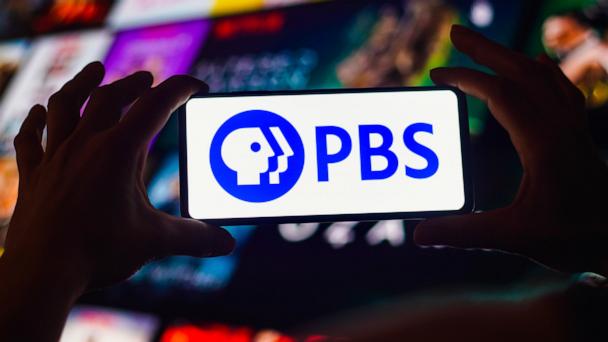 In this photo illustration, the Public Broadcasting Service (PBS) logo is displayed on a smartphone screen.