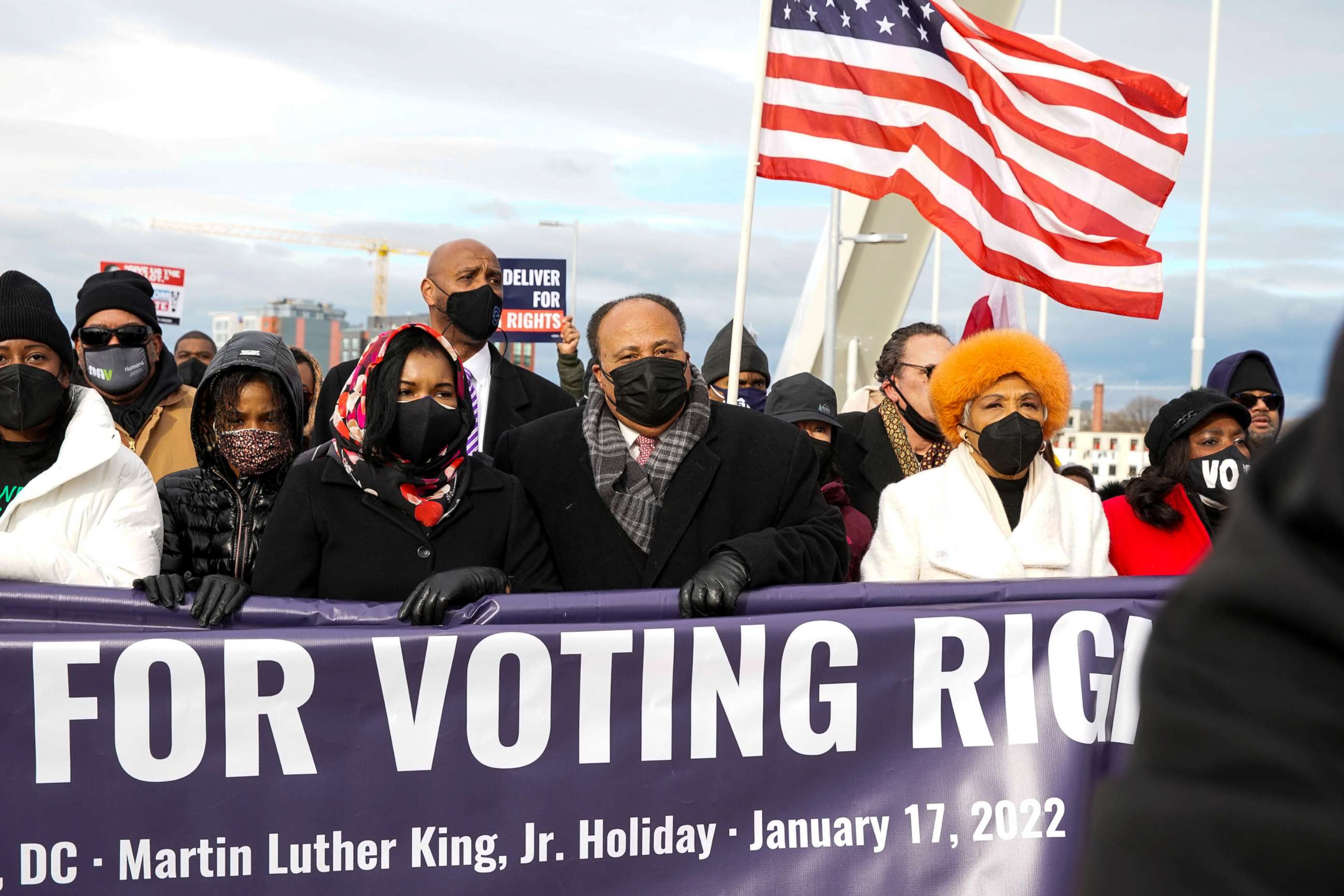 PHOTO: Martin Luther King III, his wife Arndrea Waters King and daughter Yolanda Renee King take part in a Peace Walk on the Frederick Douglass Memorial Bridge in Washington, D.C., Jan. 17, 2022.