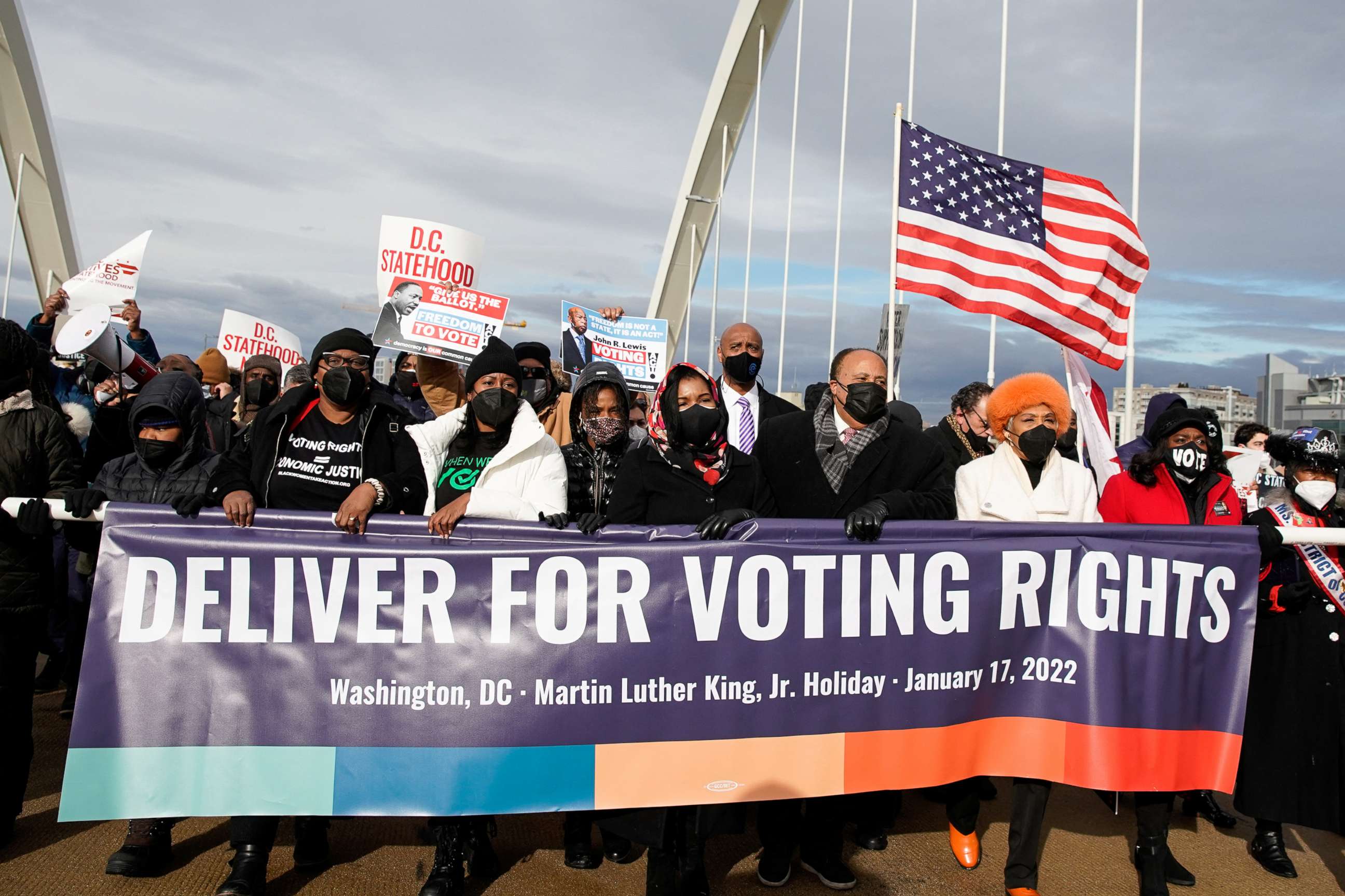 PHOTO: Martin Luther King III, his wife Arndrea Waters King and daughter Yolanda Renee King take part in a Peace Walk on the Frederick Douglass Memorial Bridge in Washington, D.C., Jan. 17, 2022.