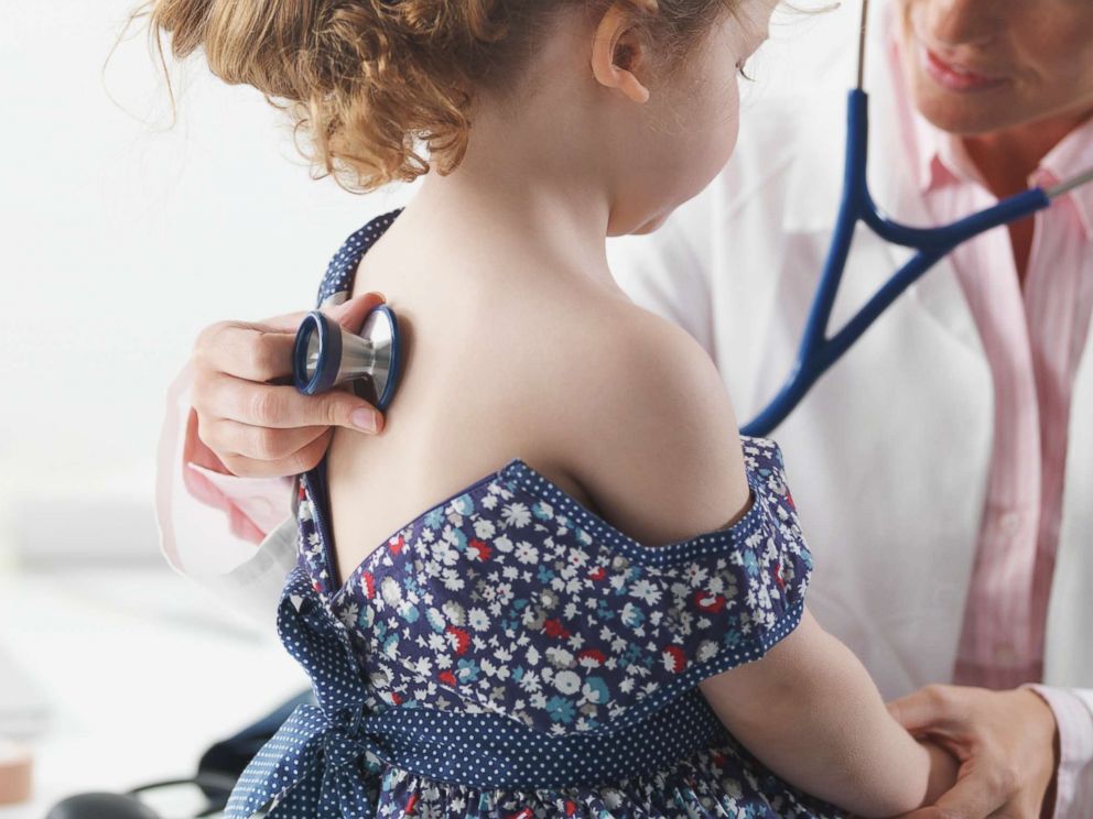 PHOTO: Doctor giving a child a checkup in an undated stock photo.