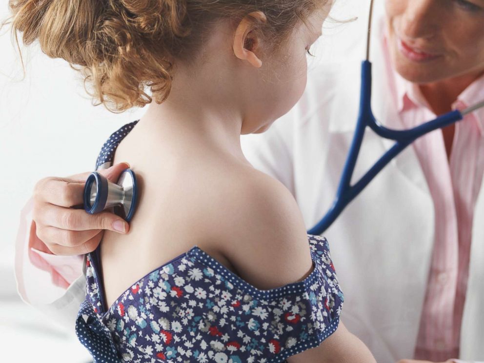 PHOTO: Doctor giving a child a checkup in an undated stock photo. 