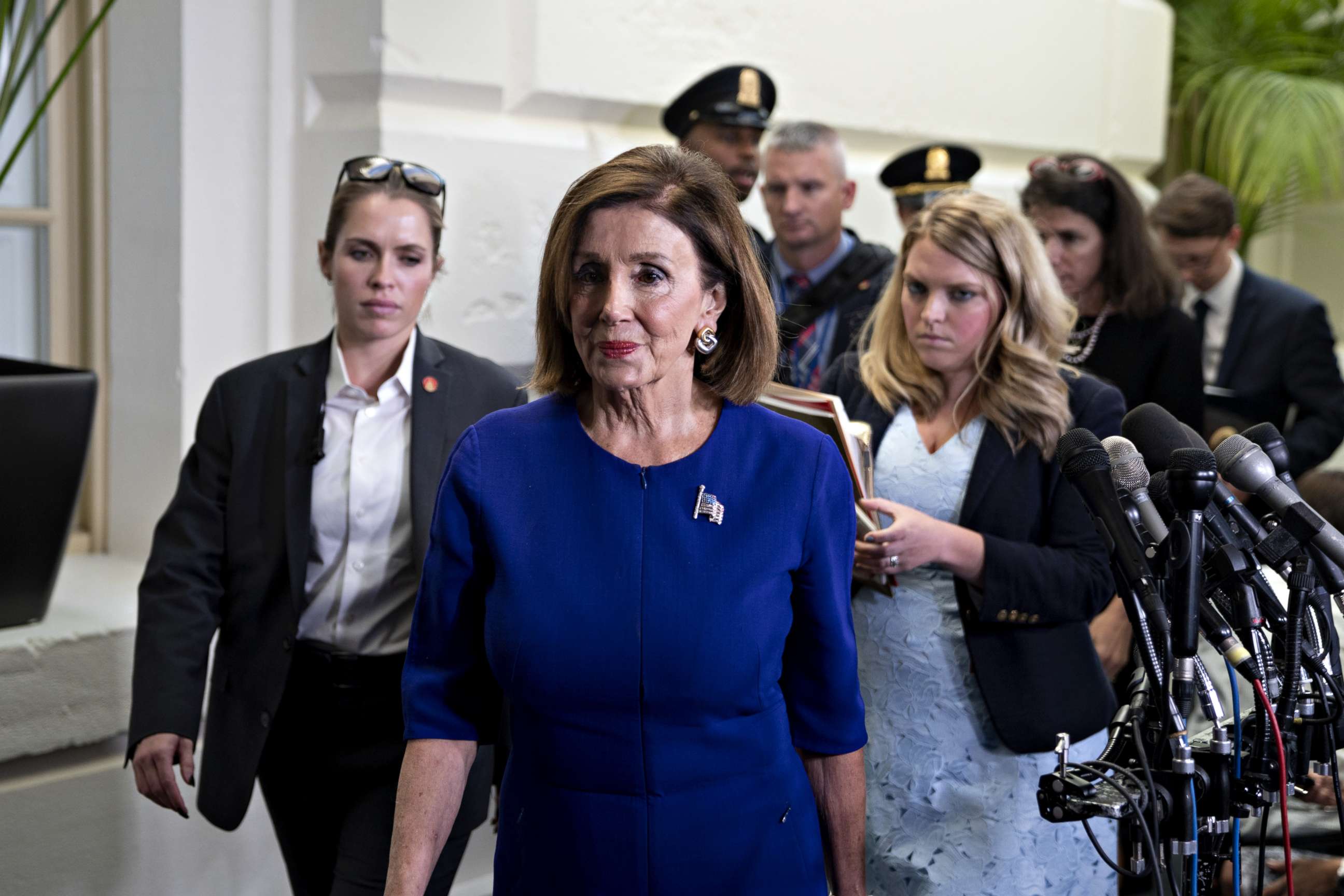 PHOTO: U.S. House Speaker Nancy Pelosi, a Democrat from California, exits a Democratic caucus meeting at the U.S. Capitol in Washington, D.C., U.S., on Tuesday, Sept. 24, 2019.