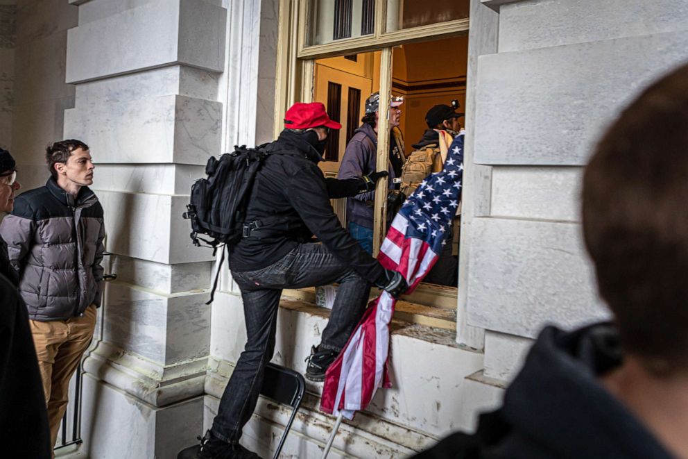 PHOTO: Protesters breach the Capitol building via a broken window, Jan. 6, 2021.