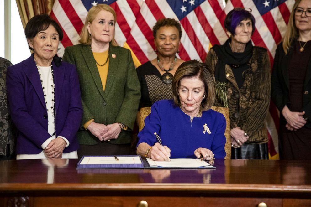 PHOTO: House Majority Leader Nancy Pelosi, D-Calif., signs the Coronavirus Emergency Response Package which passed the House with only three votes against it on Capitol Hill on March 5, 2020, in Washington, D.C. 