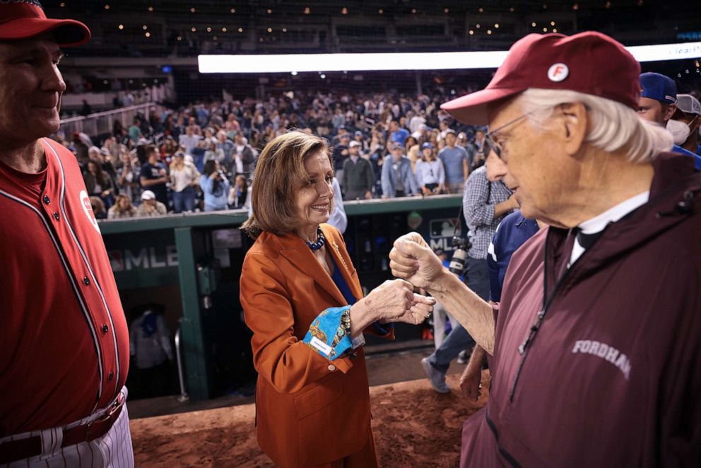 PHOTO: House Speaker Nancy Pelosi congratulates members of the Democratic team following the Congressional baseball game at Nationals Park, Sept. 29, 2021, in Washington, D.C.