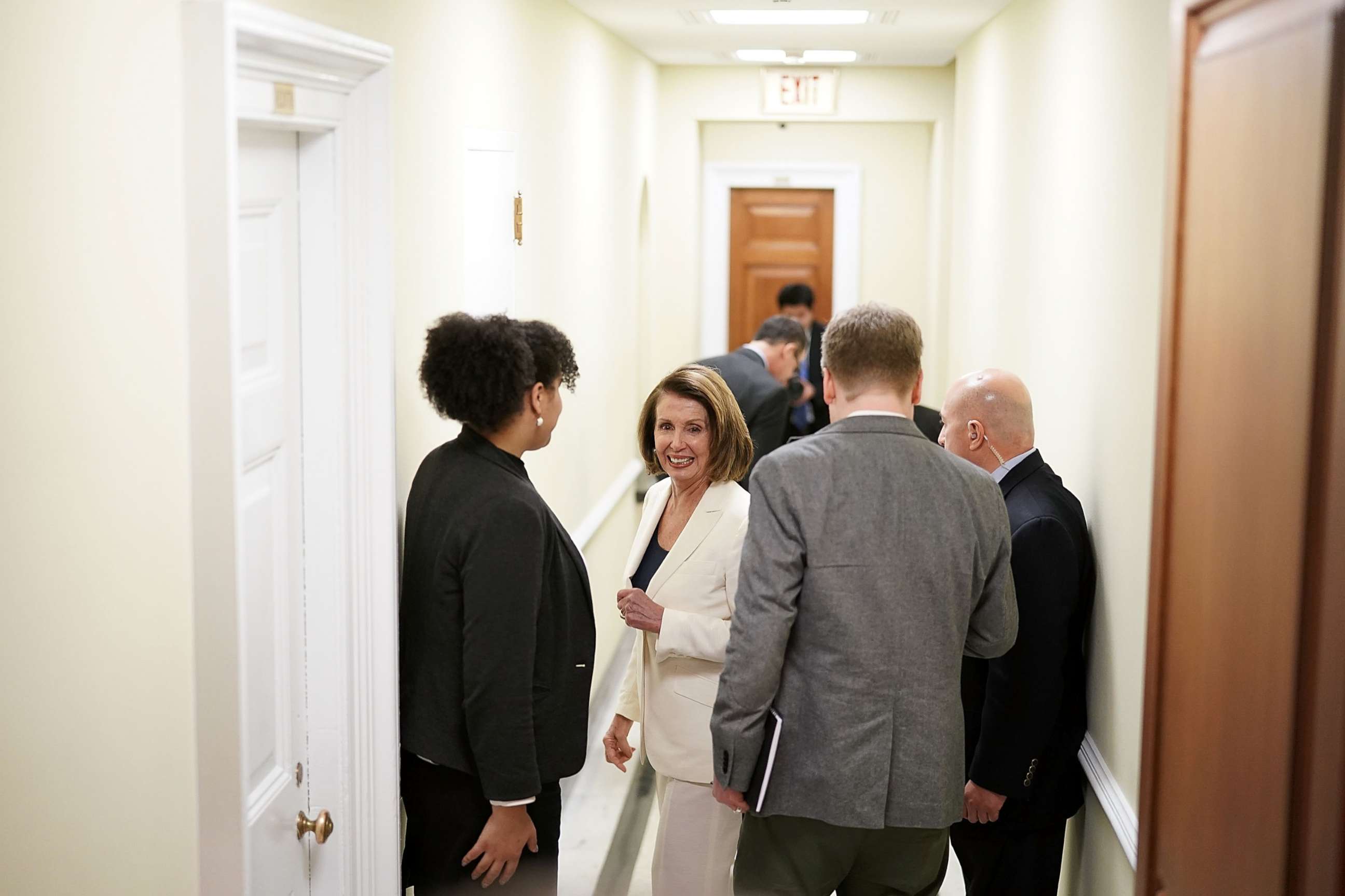 PHOTO: House Minority Leader Rep. Nancy Pelosi (D-CA) (C) on her way returns to her office after a long speech on immigration at the Capitol, Feb. 7, 2018.