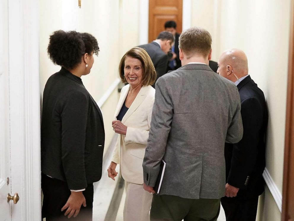 PHOTO: House Minority Leader Rep. Nancy Pelosi (D-CA) (C) on her way returns to her office after a long speech on immigration at the Capitol, Feb. 7, 2018.
