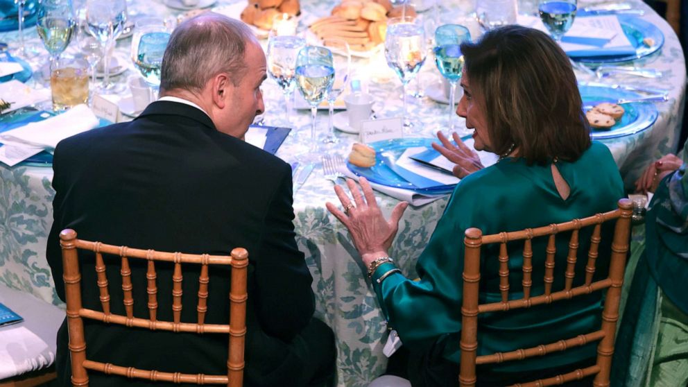 PHOTO: Irish Prime Minister Micheal Martin, left, talks with Speaker of the House Nancy Pelosi during the Ireland Funds 30thNational Gala at the National Building Museum in Washington, D.C., March 16, 2022.