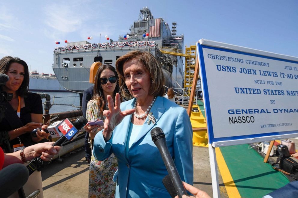 PHOTO: Speaker of the House Nancy Pelosi talks to the media in front of USNS John Lewis after a christening ceremony Saturday July 17, 2021, in San Diego.