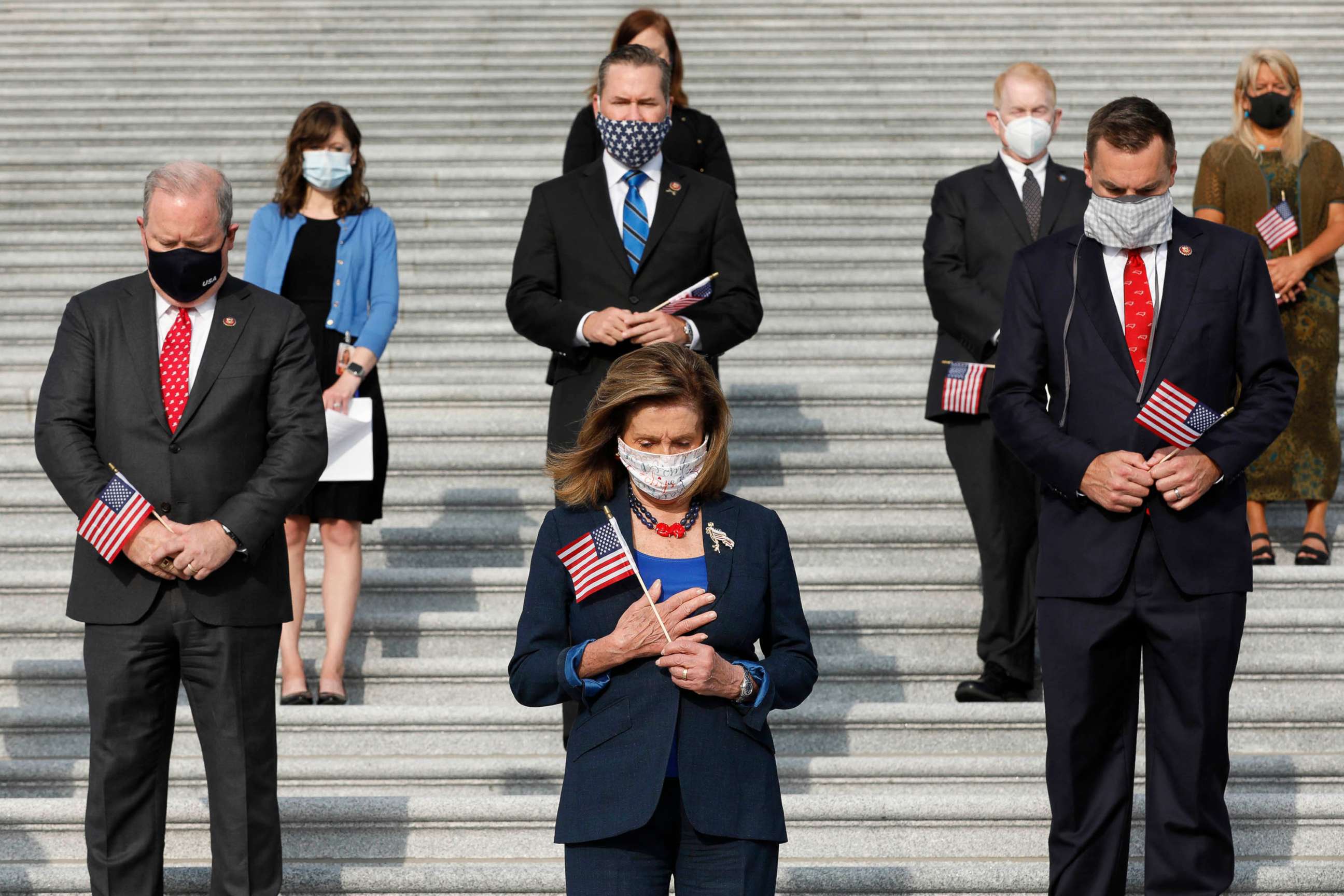 PHOTO: House Speaker Nancy Pelosi and members of Congress hold moment of silence observing National Day of Service and Remembrance on the East Front Steps on Capitol Hill in Washington on Sept. 11, 2020.