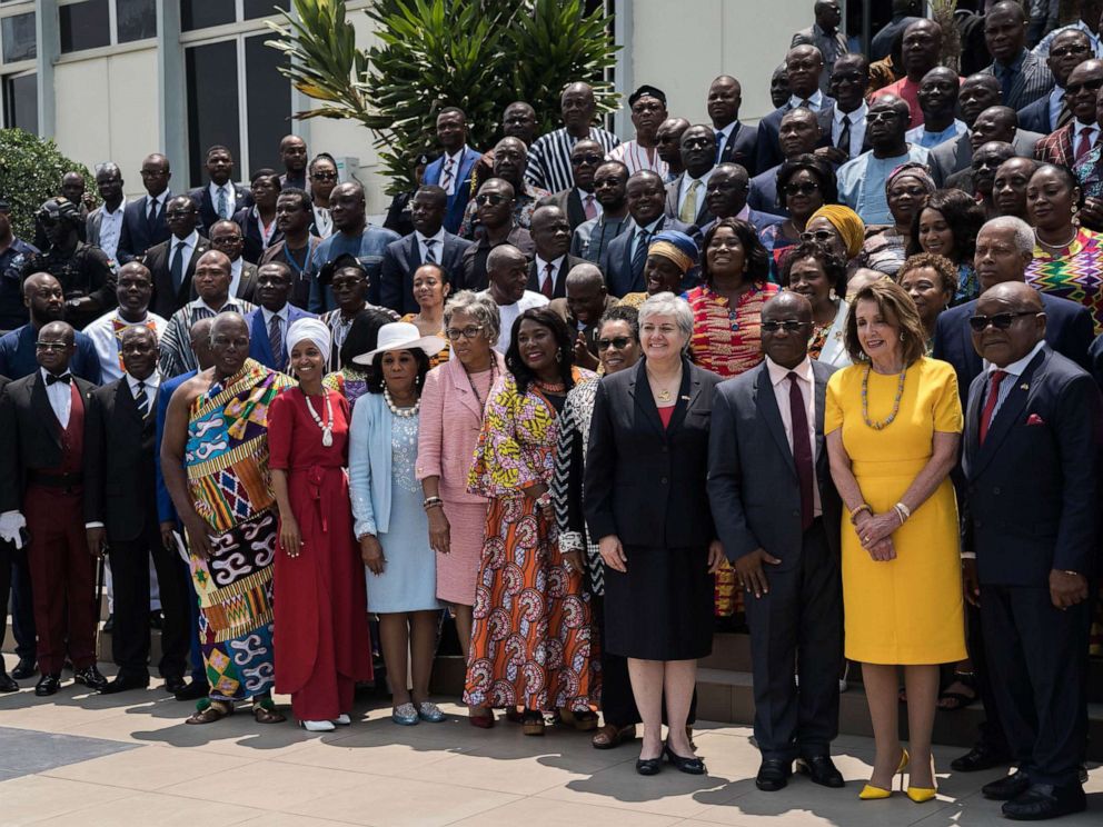 PHOTO: Speaker of the House Nancy Pelosi (2nd R), Speaker of Ghanas Parliament Mike Aaron Oquaye (R) and US Representative Ilhan Omar (5th L) pose for a family picture with members of Parliament in front of the Ghanas Parliament in Accra, July 31, 2019.