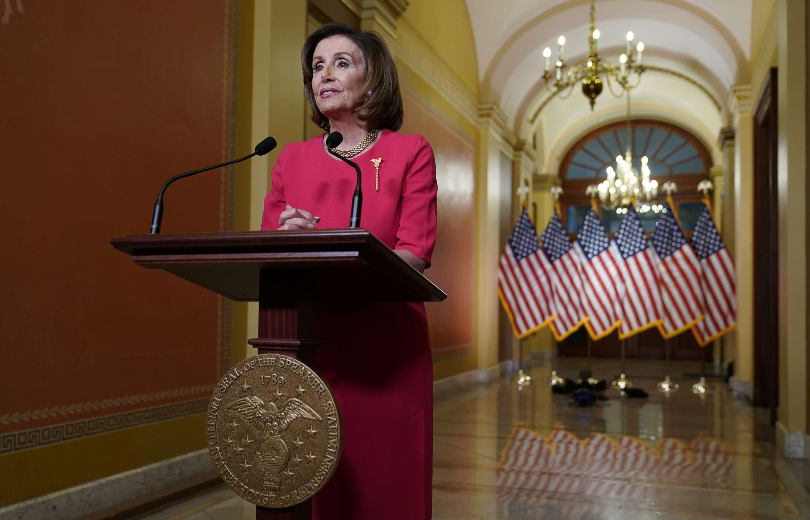 PHOTO: House Speaker Nancy Pelosi makes a statement about the government's response to coronavirus disease (COVID-19) from the Speakers Lobby on Capitol Hill in Washington, March 23, 2020.