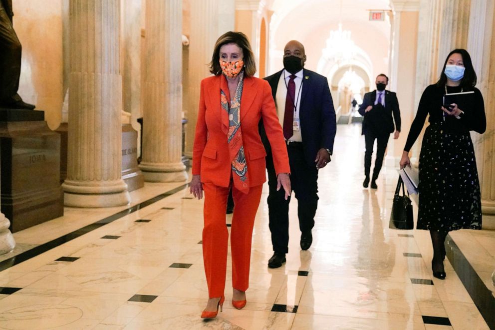 PHOTO: House Speaker Nancy Pelosi (D-CA) walks through the Capitol, Dec. 17, 2020. 