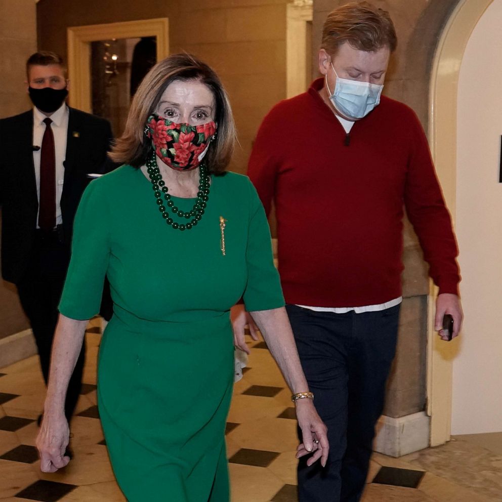 PHOTO: Speaker of the House Nancy Pelosi walks back to her office after opening the House floor following an agreement of a coronavirus disease (COVID-19) aid package the night before on Capitol Hill, Washington, D.C., Dec. 21, 2020.