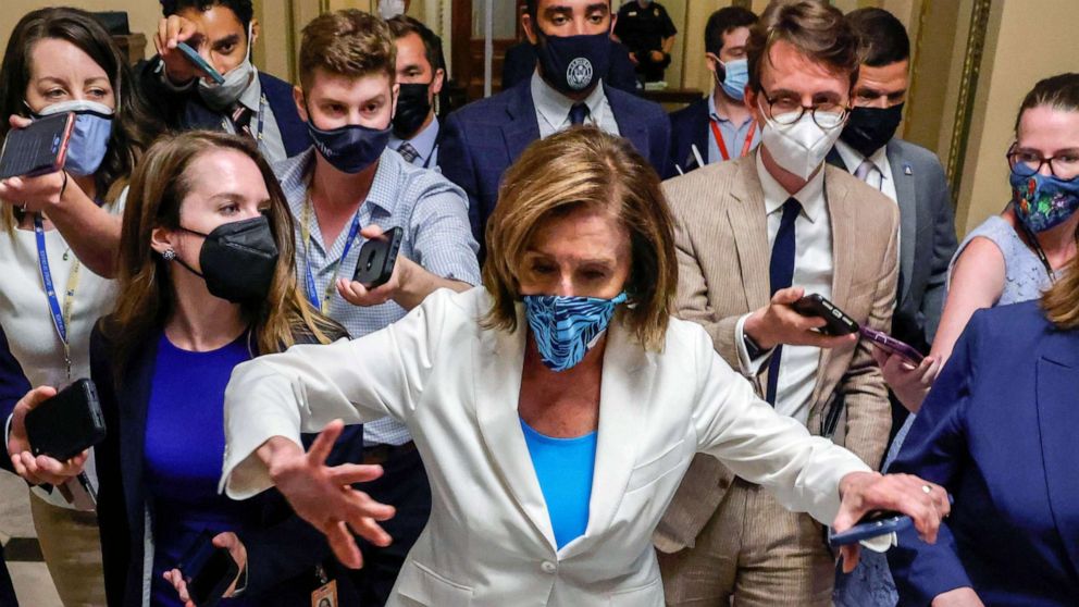 PHOTO: House Speaker Nancy Pelosi is trailed by reporters as she departs a meeting with fellow House Democrats at the Capitol in Washington, Aug. 23, 2021.