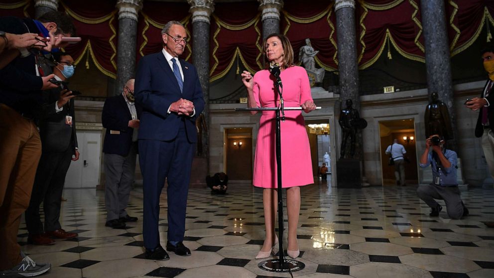 PHOTO: House Speaker Nancy Pelosi speaks, flanked by Senate Minority Leader Chuck Schumer after meeting with the White House Chief of Staff and the US Treasury Secretary on coronavirus relief at the US Capitol in Washington, Aug. 7, 2020.