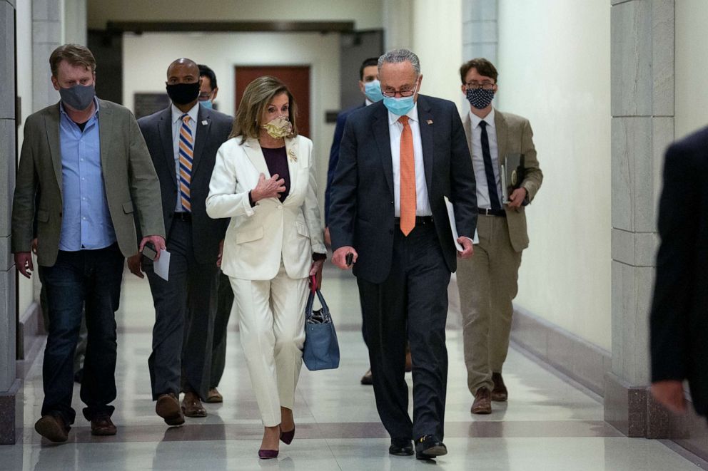 PHOTO: Senate Minority Leader Charles Schumer, D-N.Y., and Speaker of the House Nancy Pelosi, D-Calif., arrive to her weekly news conference at the U.S. Capitol on Aug. 6, 2020 in Washington, D.C.
