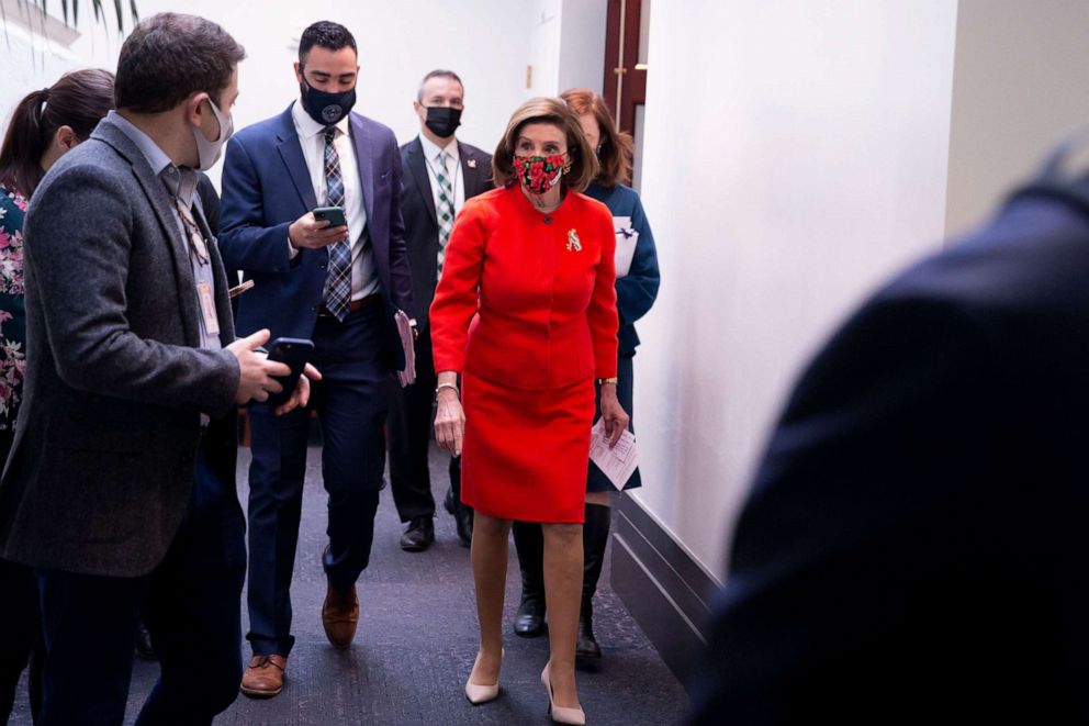 PHOTO: Speaker of the House Nancy Pelosi is followed by members of the media as she leaves after a House Democratic Caucus meeting on Capitol Hill in Washington, D.C., Dec. 8, 2021.
