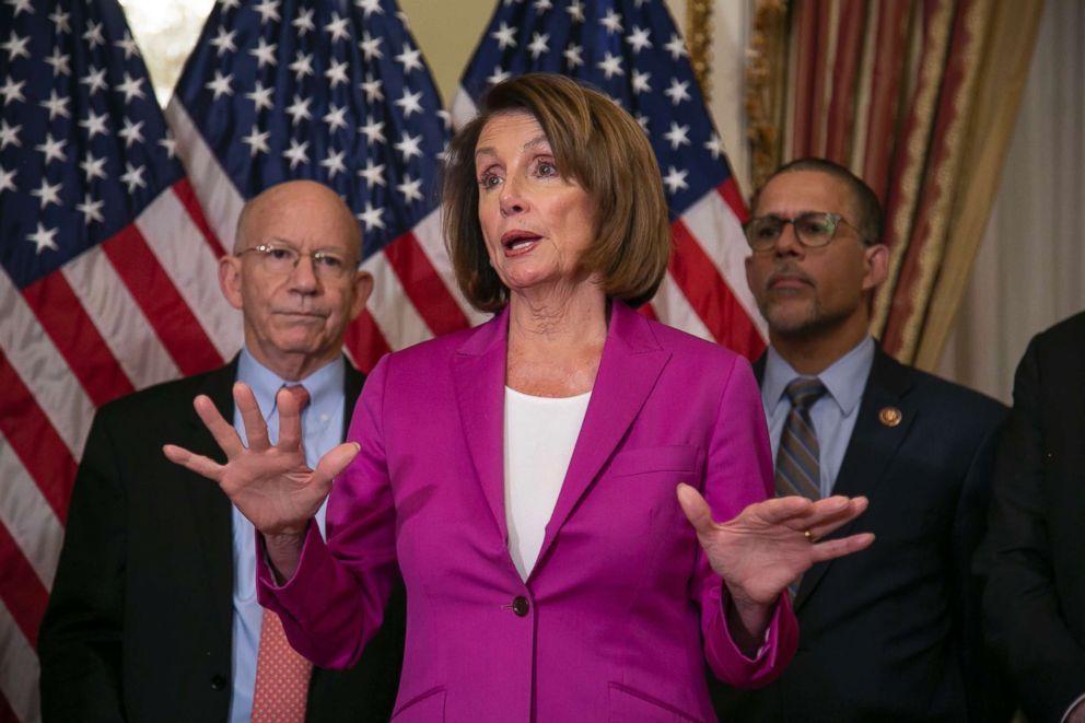 PHOTO: Speaker of the House Nancy Pelosi talks to reporters after signing a bill requiring that government workers receive retroactive pay after shutdown ends, at the U.S. Capitol, Jan. 11, 2019.