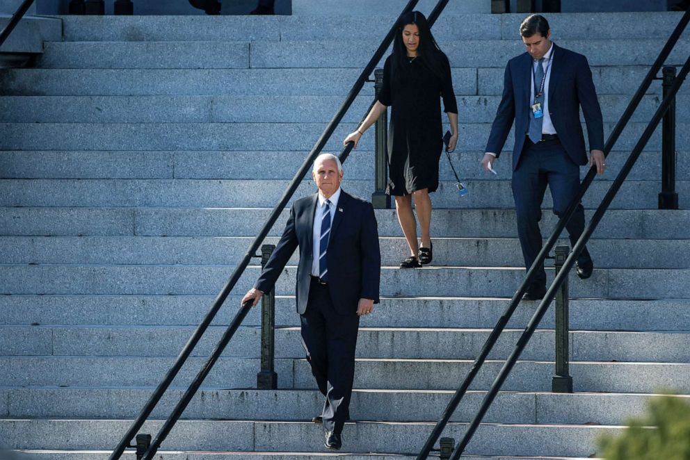 PHOTO: Vice President Mike Pence walks out of the Eisenhower Executive Office Building to attend meetings at the White House, Nov. 9, 2020. 