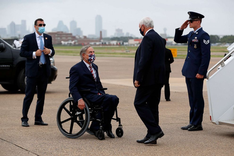 PHOTO: Texas Gov. Greg Abbott, center left, greets Vice President Mike Pence upon his arrival at Love Field in Dallas, June 28, 2020.