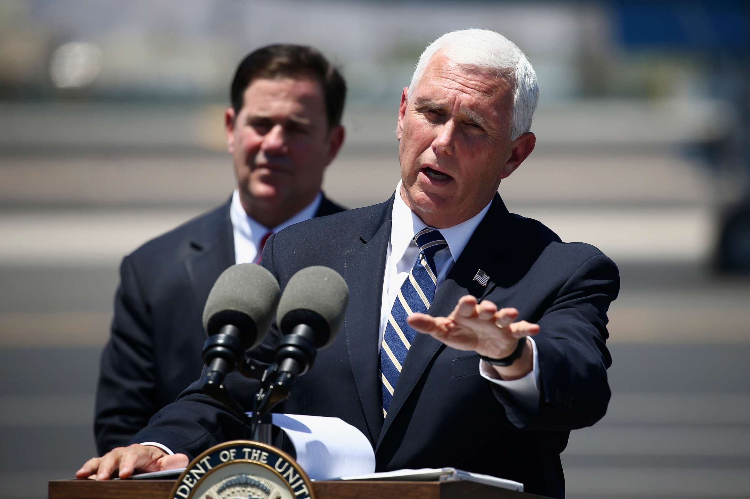 PHOTO: Vice President Mike Pence, right, answers a question as he holds a news conference with Arizona Gov. Doug Ducey, left, after their meeting to discuss the surge in coronavirus cases in Arizona Wednesday, July 1, 2020, in Phoenix.