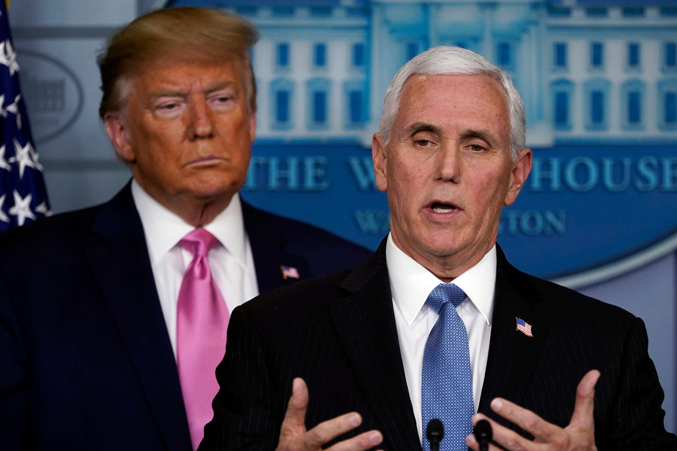 PHOTO: Vice President Mike Pence speaks as President Donald Trump listens during a news conference about the coronavirus in the Brady Press Briefing Room of the White House, Feb. 26, 2020, in Washington. 