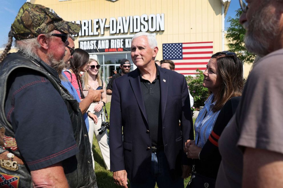 PHOTO: Former Vice President Mike Pence meets other riders before for the start of Joni Ernst's Roast and Ride on June 03, 2023 in Des Moines, Iowa.