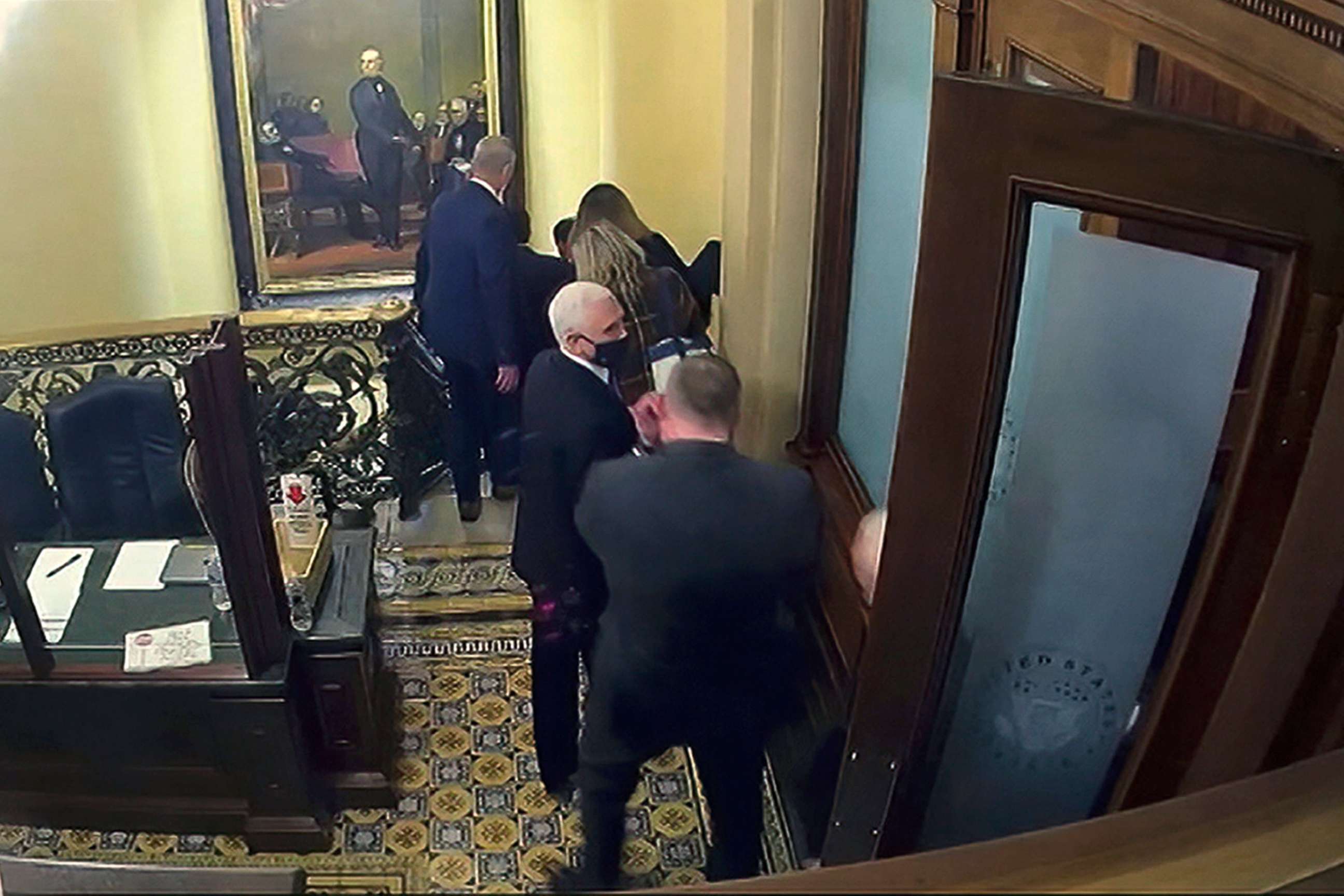PHOTO: A security video shows Vice President Mike Pence being evacuated from near the Senate chamber as rioters breach the Capitol, on Jan. 6, 2021, in Washington, D.C. 