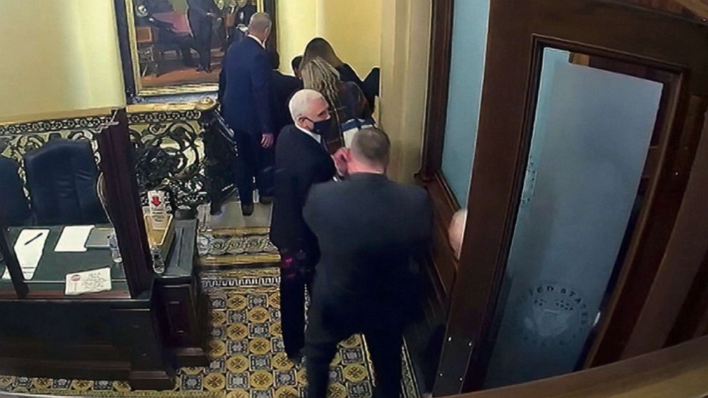 PHOTO: A security video shows Vice President Mike Pence being evacuated from near the Senate chamber as rioters breach the Capitol, on Jan. 6, 2021, in Washington, D.C. 