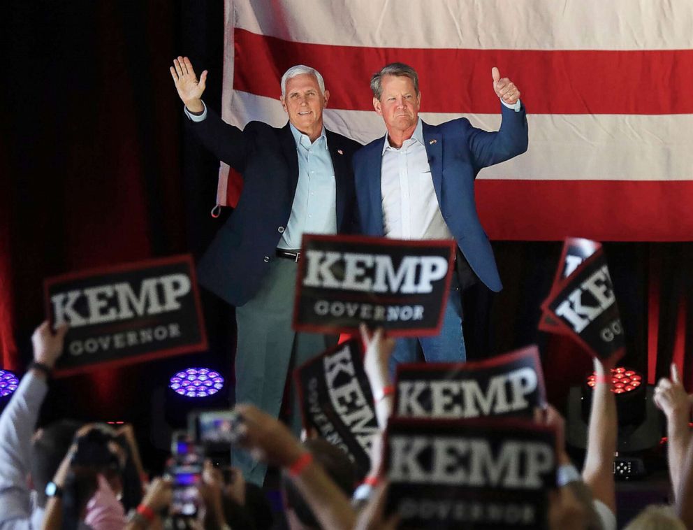  Former Vice President Mike Pence joins Governor Brian Kemp for a campaign rally on the eve of Georgia's primary at the Cobb County International Airport, May 23, 2022, in Kennesaw, Ga.