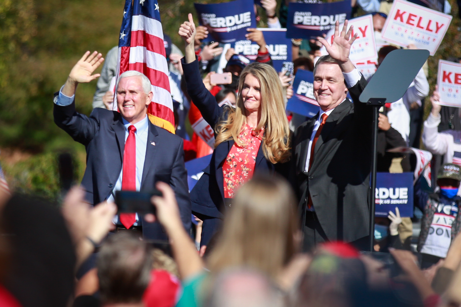 PHOTO: Vice President Mike Pence waves to supporters at a rally in Canton, Ga., along with Sen. David Perdue and Sen. Kelly Loeffler, Nov. 20, 2020.