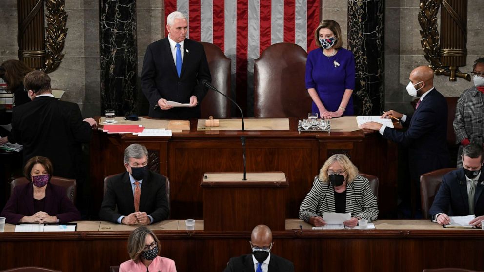 PHOTO: Vice President Mike Pence and Speaker of the House Nancy Pelosi take part in a joint session of Congress to certify the 2020 election results at the U.S. Capitol in Washington, D.C., Jan. 6, 2021.