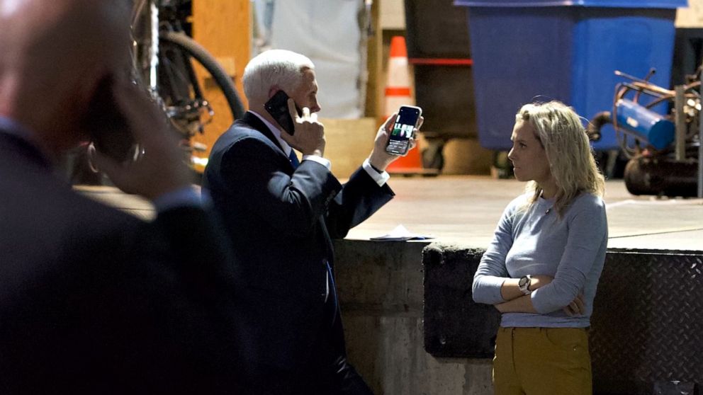 PHOTO: A photo taken on Jan. 6, 2021 shows Vice President Mike Pence looking at a tweeted video by President Donald Trump in an underground parking garage of the U.S. Capitol.