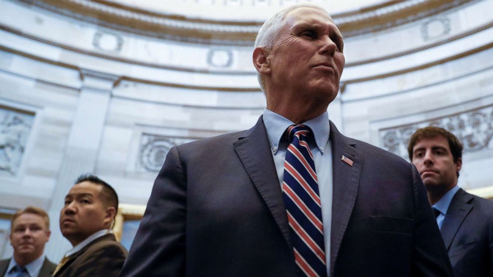 PHOTO: Vice President Mike Pence talks with Capitol visitors after he attended the weekly Republican Senate policy luncheon on Capitol Hill in Washington, Dec. 17, 2019.