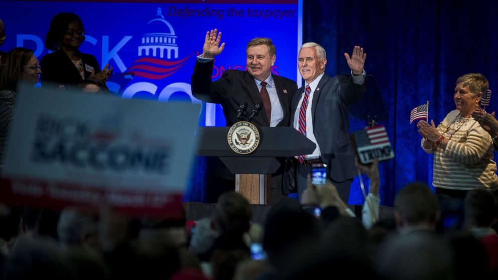 Republican Pennsylvania congressional candidate Rick Saccone and Vice President Mike Pence acknowledge the audience during a campaign event at the Bethel Park Community Center, Febru 2, 2018 in Bethel Park, Pennsylvania.