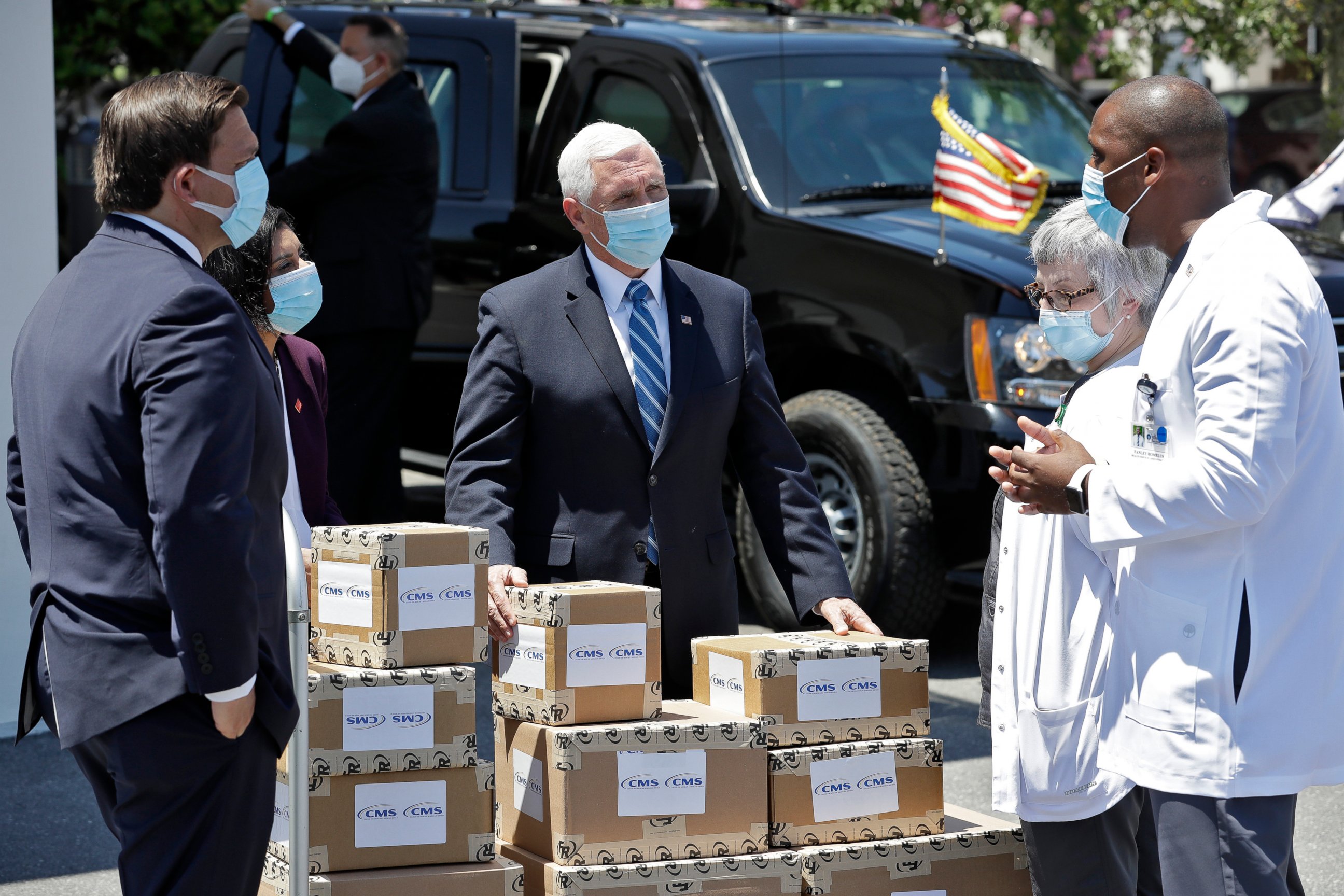 PHOTO: Vice President Mike Pence, center, speaks to staff members after delivering personal protective equipment to the Westminster Baldwin Park, Wednesday, May 20, 2020, in Orlando, Fla., as part of the initiative to deliver PPE to nursing homes. 