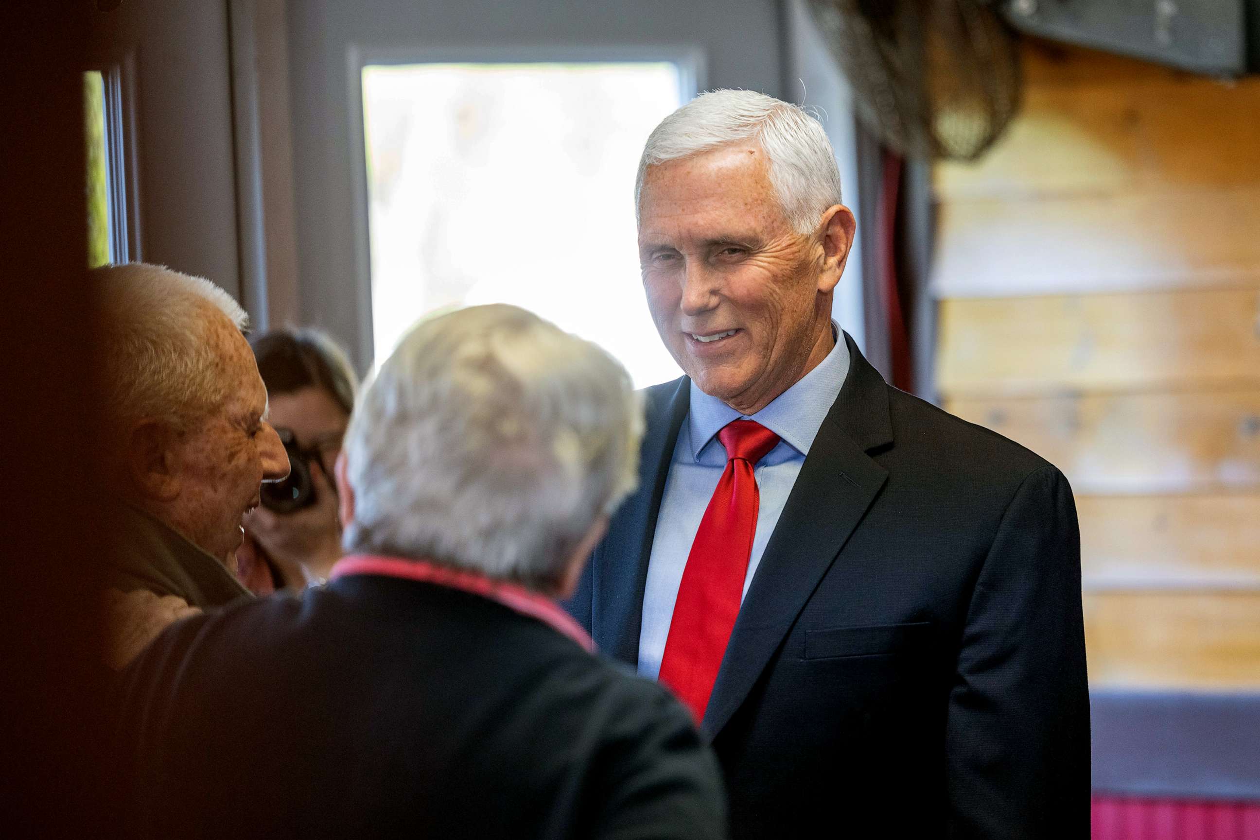 PHOTO: Former Vice President Mike Pence greets guests at a "Lumber and Lobster" event on May 17, 2023 in Dover, N.H.