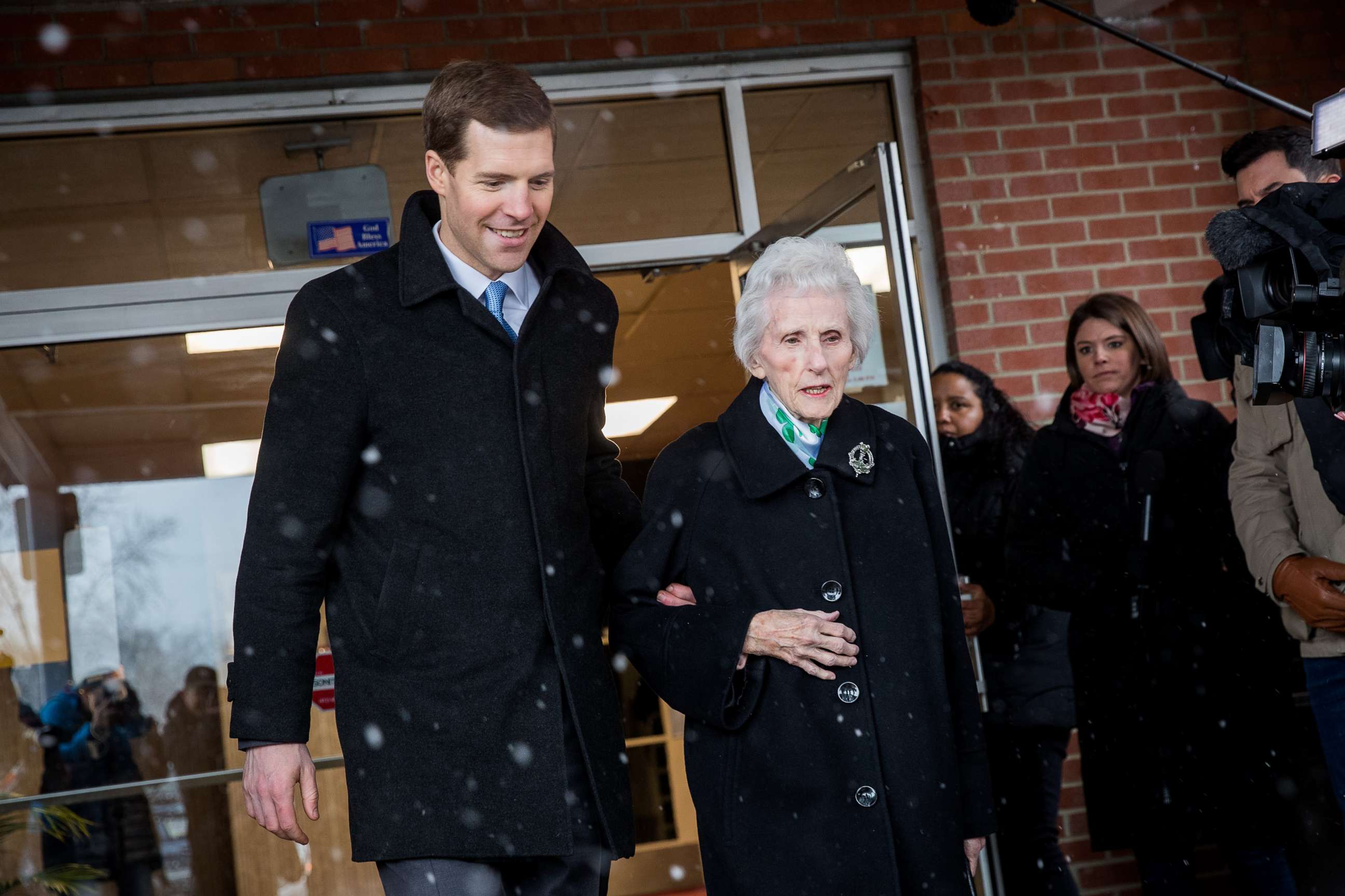 PHOTO: Conor Lamb, Democratic congressional candidate for Pennsylvania's 18th district, and his grandmother Barbara Lamb exit the polling station after she voted at Our Lady of Victory Church, March 13, 2018 in Carnegie, Pennsylvania.