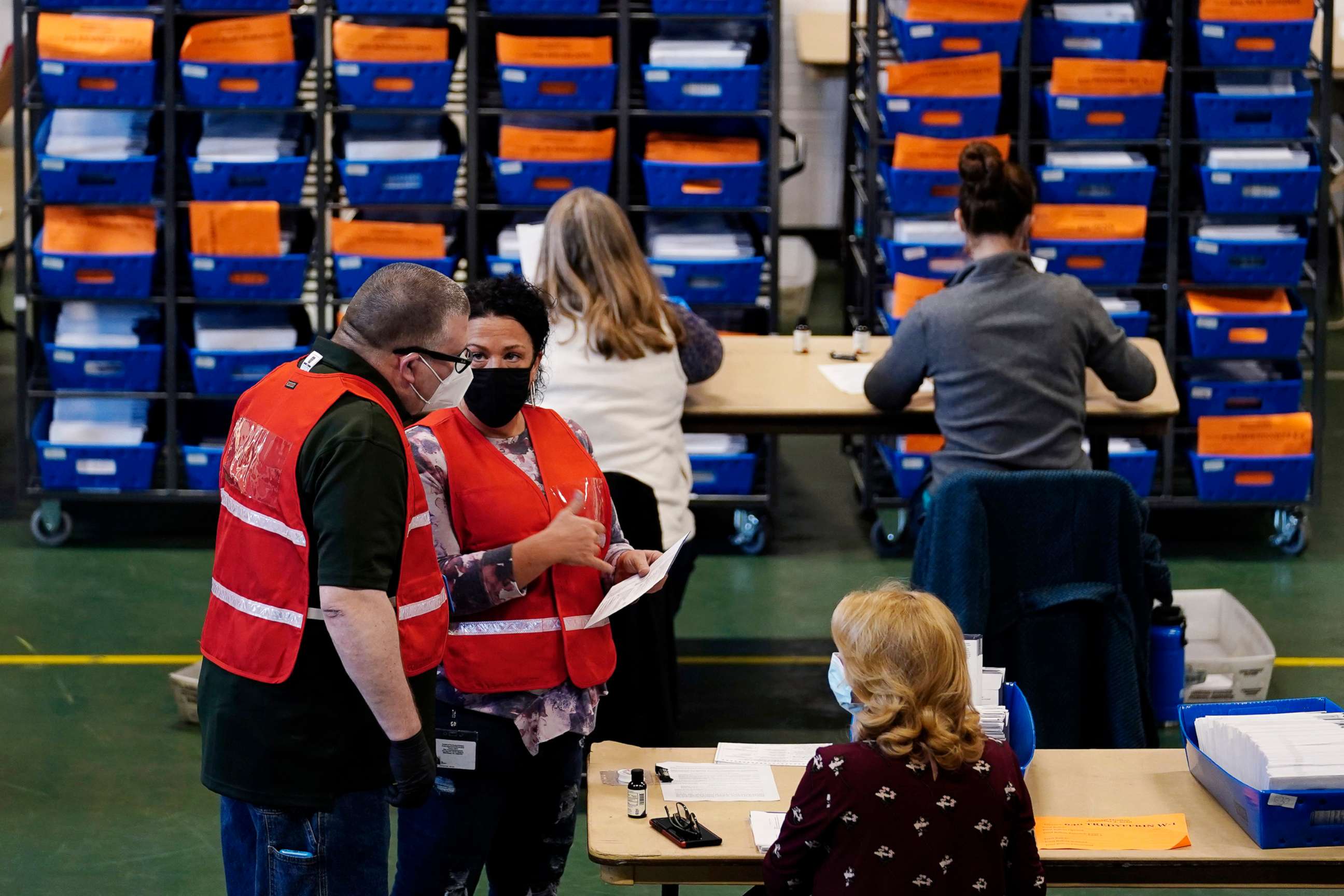 PHOTO: Election workers check mail-in and absentee ballots for the 2020 General Election  at West Chester University, Nov. 3, 2020, in West Chester, Pa.